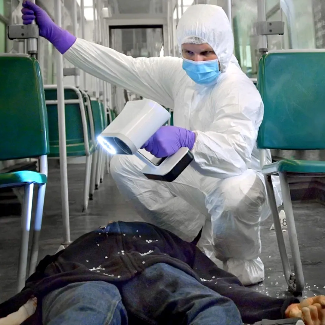 Forensic specialist documenting a mock crime scene with an Artec Leo 3D scanner